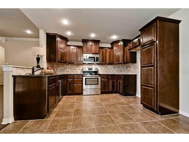 Kitchen. Tile floor for easy maintenance.