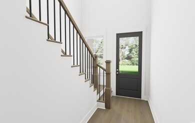 Entrance foyer with wood-type flooring