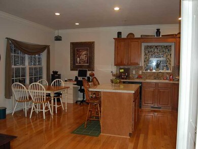 Kitchen. Bar and prep space and eat in area of kitchen.  Hardwood flooring