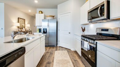Kitchen featuring sink, hardwood / wood-style floo