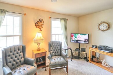 Full length windows in living provides natural light.