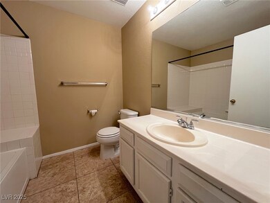 Bathroom with toilet, vanity, bathing tub / shower