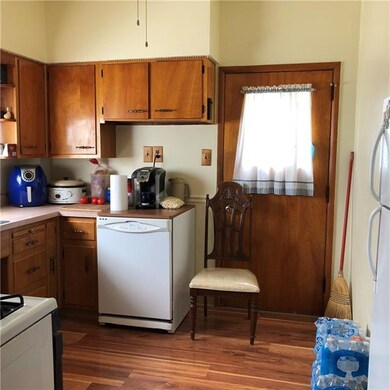 The Kitchen has newer laminate flooring and solid 