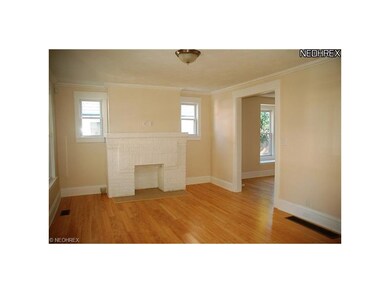 Living room with decortive firepalce and newer bam