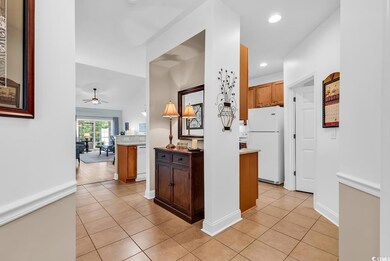 Kitchen featuring white appliances, light tile patterned flooring, ceiling fan, recessed lighting, and light countertops