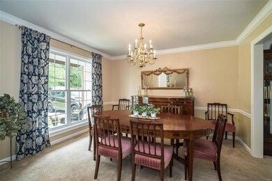 The 13 x 12 Dining Room has crown molding and larg