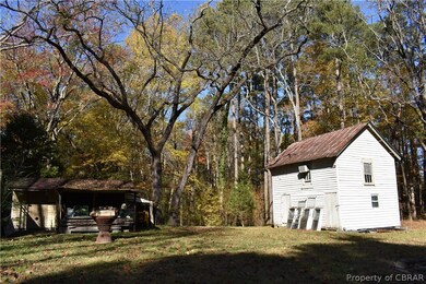 Outbuildings - 2 story barn and shed.  Path to Cob
