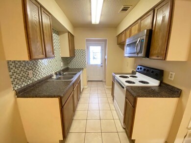 Kitchen featuring a sink, white electric range ove