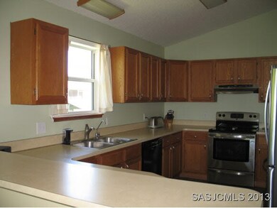 Kitchen w/bar open to living