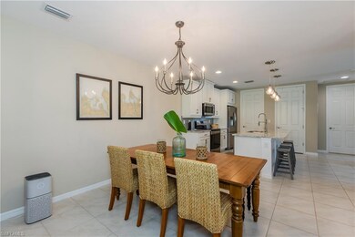 Large Dining space featuring a high end chandelier