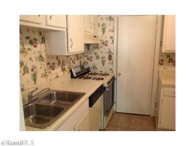 Kitchen. Door shown in picture leads to pantry/laundry