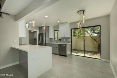 Waterfall edge quartz counter in kitchen