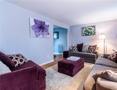 The living room- NEUTRAL COLRS and FINISHED HARDWO