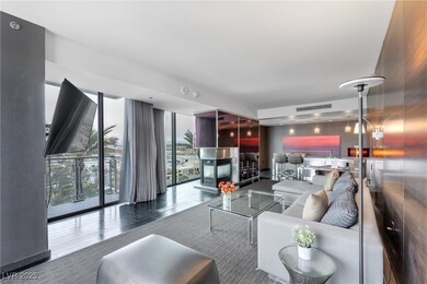 Living area with a fireplace and visible vents