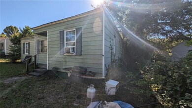 View of side of home with cooling unit