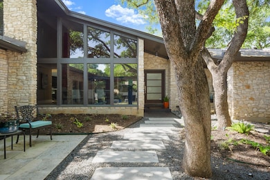 Entrance to property with stone siding