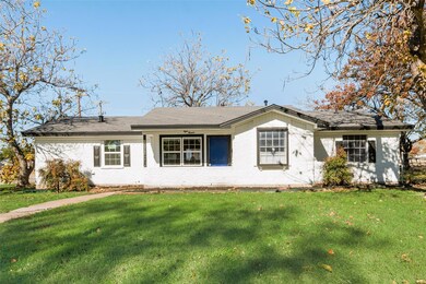 Ranch-style home with a front yard