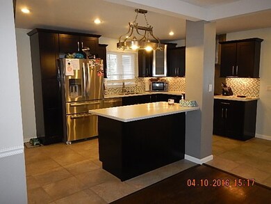 BEAUTIFUL KITCHEN WITH STAINLESS APPLIANCES INCLUDED.  CENTER ISLAND WORKING AREA OR EXTRA SEATING AREA CERAMIC TILE FLOORING