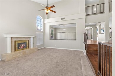 Unfurnished living room featuring a towering ceili