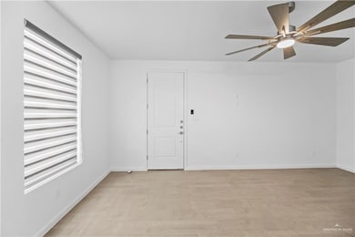 Unfurnished living room with recessed lighting, light wood-type flooring, a ceiling fan, and baseboards