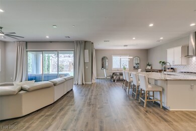 Living room featuring recessed lighting, light wood finished floors, and ceiling fan