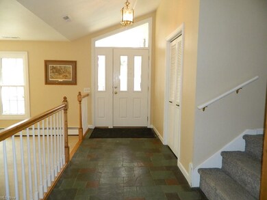 Welcoming Vaulted, Slate Foyer Entrance with Large Guest Closet - Lots of Natural Light Illuminating the Entryway!