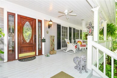 Welcoming front porch is a perfect gathering spot for family and friends