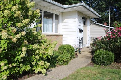 Beautiful plantings adorn the front walkway.