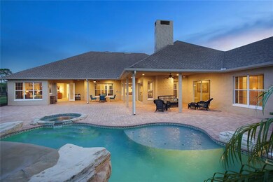 Pool and spa with rock waterfall and fiber-optic l
