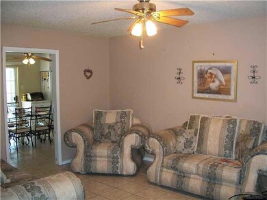 Living Room. Ceramic tile flooring thoug