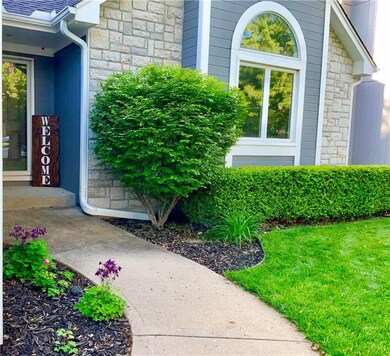 Welcoming walkway to the front door wrapped in tas