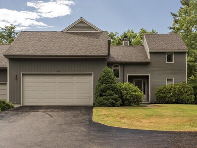 Front exterior, driveway and garage...