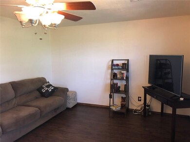 Living room has laminate wood floors.