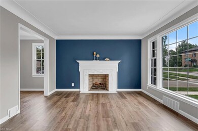 Living room with new LVT flooring, new windows, fr