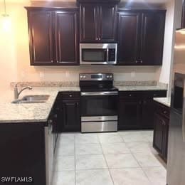 Kitchen featuring appliances with stainless steel