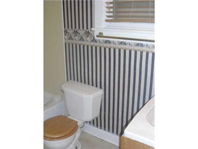 Full Bath. First Level Bath across from Bedroom on