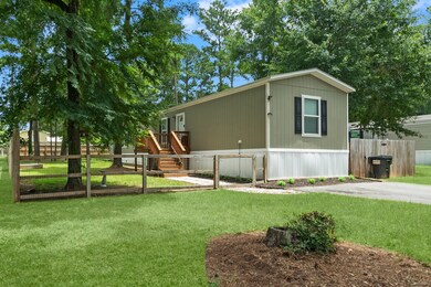 Enjoy the lush, green yard on 1/4 acre and a welcoming front porch.