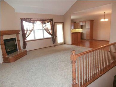 The living room features a spacious open floor pla