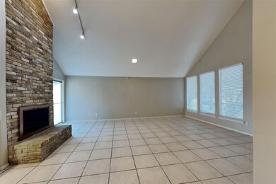 Unfurnished living room featuring high vaulted cei