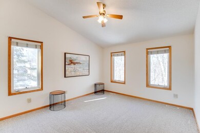 The master bedroom of this end unit features an ad