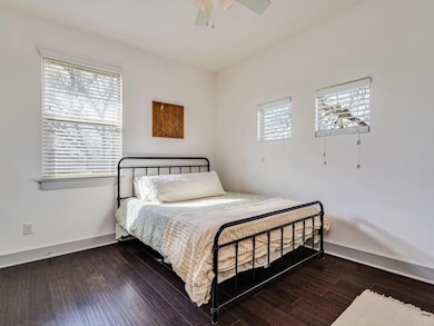 Bedroom featuring a ceiling fan, baseboards, and 