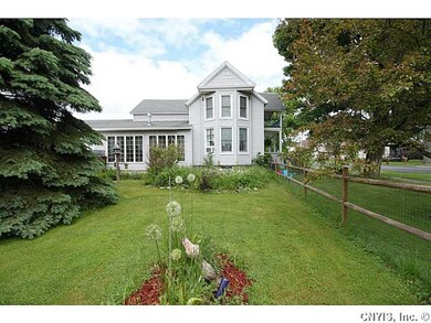 Exterior Front. Portion of large yard which is par