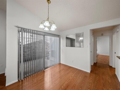 Unfurnished dining area featuring baseboards, vaul