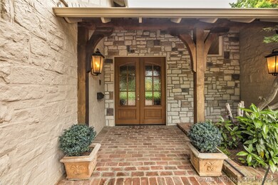 View of exterior entry featuring french doors and