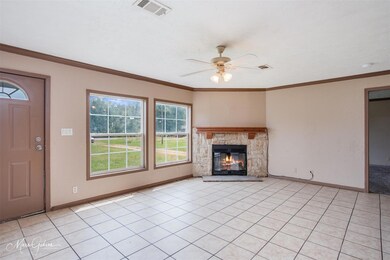 Unfurnished living room featuring ornamental moldi