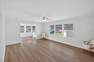 Spacious Living Room looking into Bonus Florida Room on front of home.