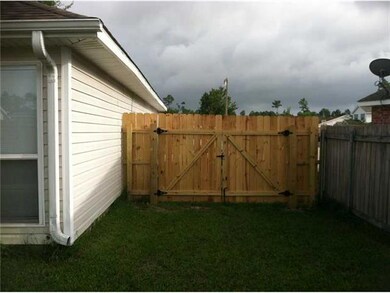 Exterior Back. Double Gate for Access to Rear Yard