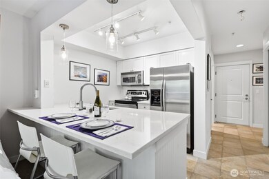 Bright kitchen with quartz countertops.