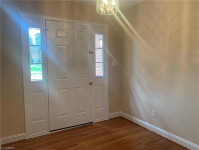 Entrance Foyer features Twin Sidelights, and Red Oak Hardwood Floors