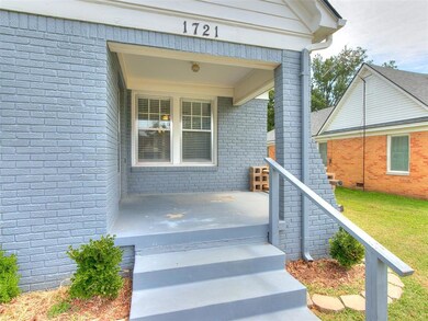 Doorway to property featuring a yard